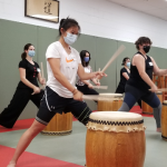 Participants learn to play the taiko in "beta" style.