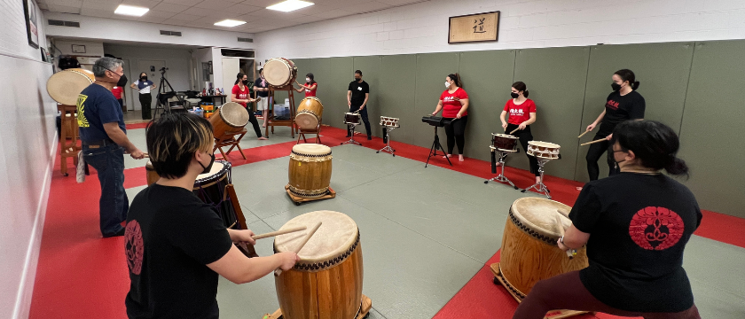 A jam session with former members, current members, and trainees.